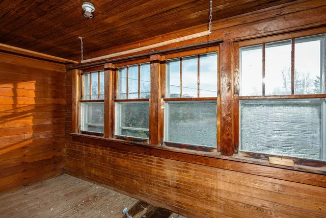 a view of grassy field with trees