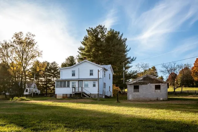 a view of a field with an trees