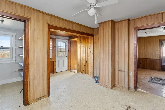 a view of a kitchen and a sink cabinet window and wooden floor