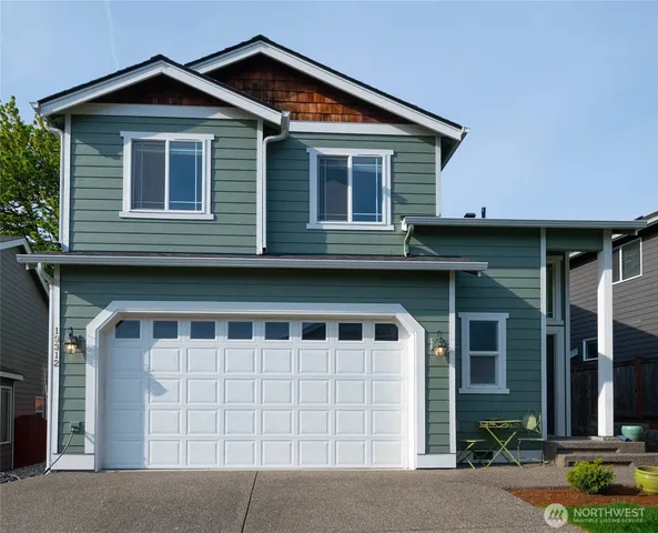 a view of a house with garage