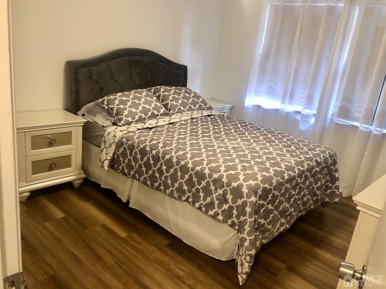 233 Edpas Road New Brunswick, NJ 08901 - Photo 12 of 18 a bedroom with bed and a window