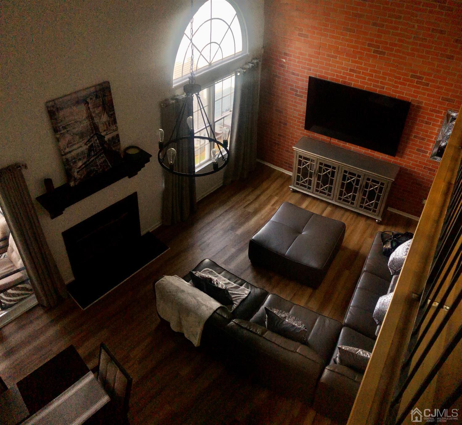 233 Edpas Road New Brunswick, NJ 08901 - Photo 2 of 18 a living room with furniture and a flat screen tv