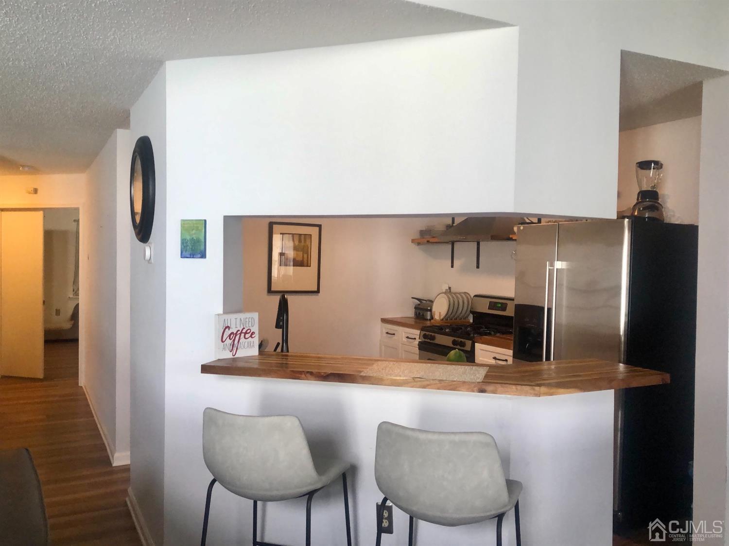 233 Edpas Road New Brunswick, NJ 08901 - Photo 6 of 18 a kitchen with a table and chairs