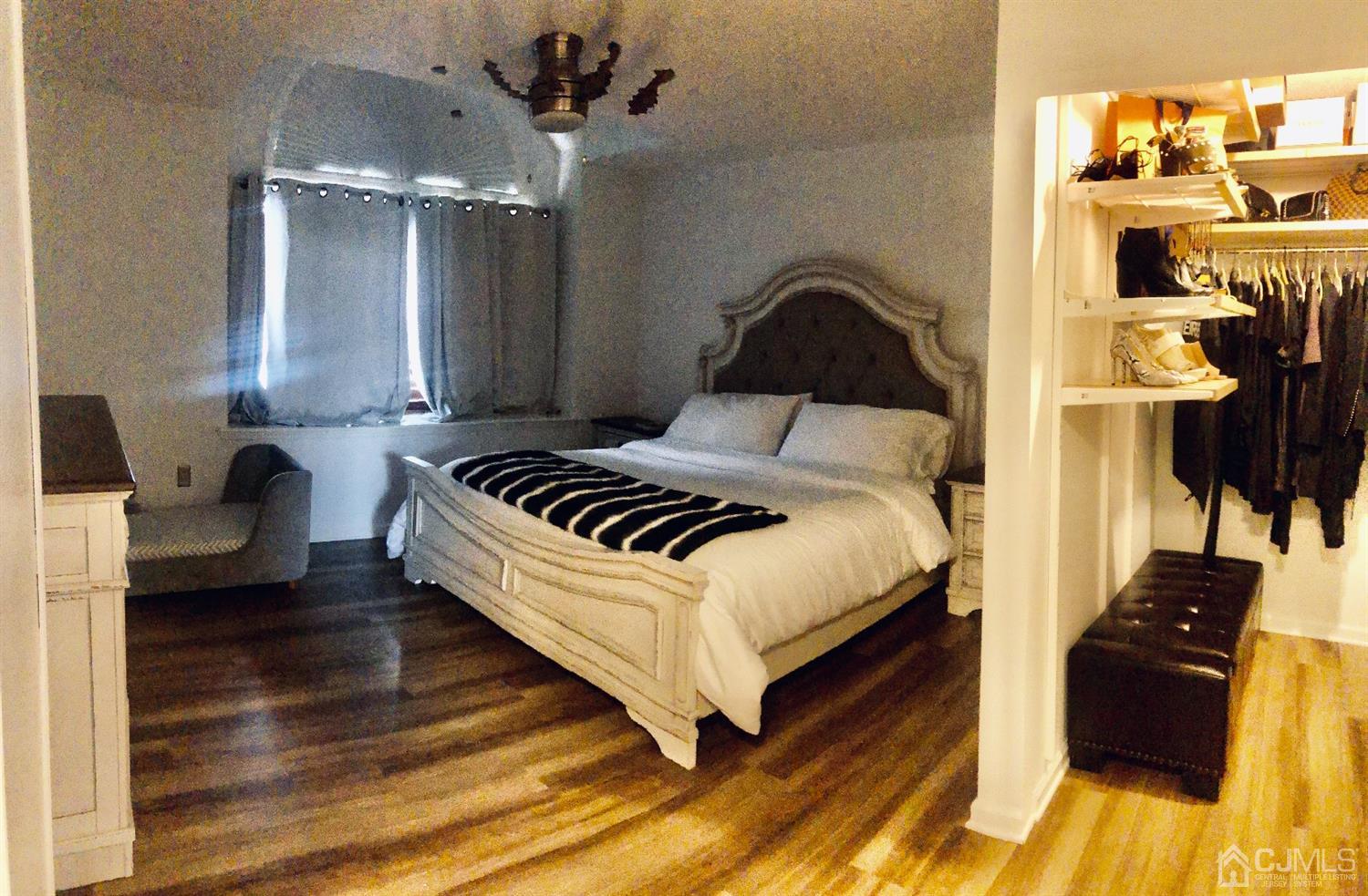 233 Edpas Road New Brunswick, NJ 08901 - Photo 10 of 18 a bedroom with a bed and wooden floor