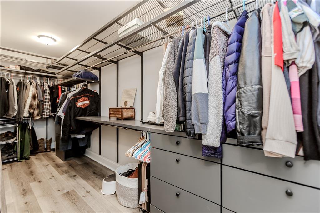 43 Water Lily Way Pendergrass, GA 30567 - Photo 27 of 71 a view of walk in closet with clothes and shoes
