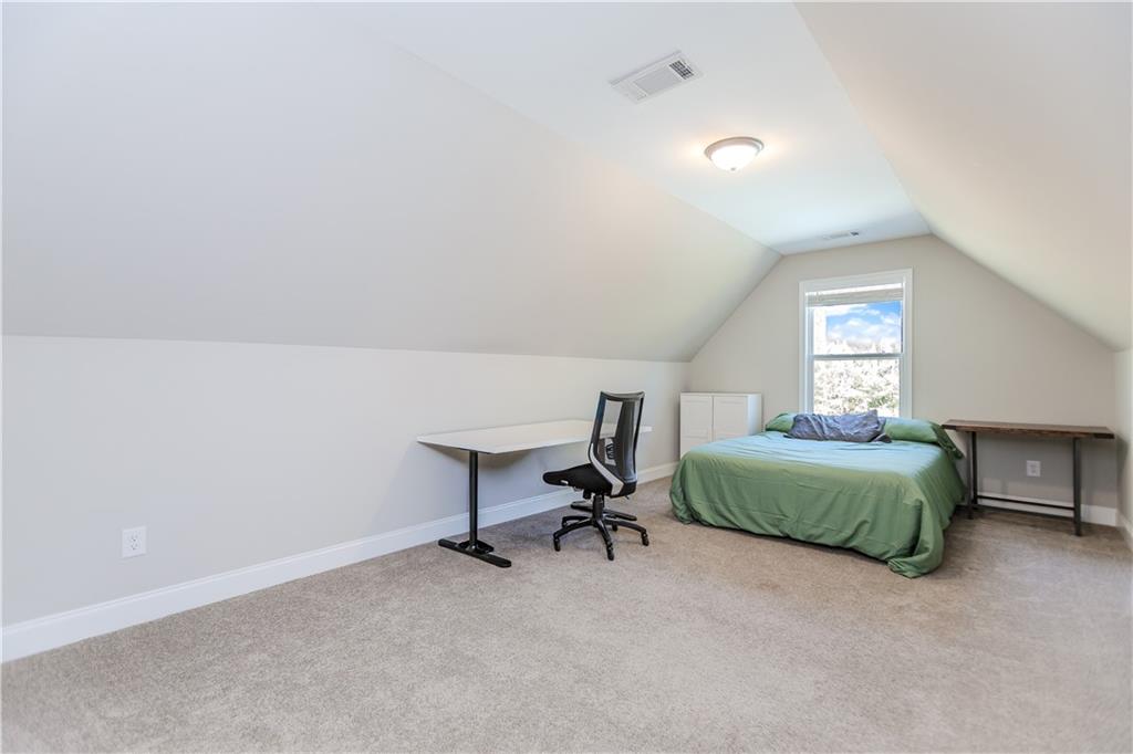 43 Water Lily Way Pendergrass, GA 30567 - Photo 29 of 71 a bedroom with a bed and a window