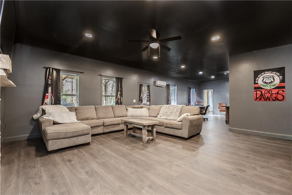 43 Water Lily Way Pendergrass, GA 30567 - Photo 32 of 71 a living room with furniture and a chandelier
