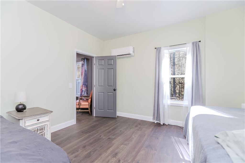 43 Water Lily Way Pendergrass, GA 30567 - Photo 37 of 71 a spacious bedroom with a bed and a window