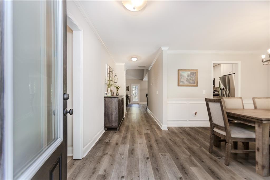 43 Water Lily Way Pendergrass, GA 30567 - Photo 5 of 71 a view of a dining room with furniture and wooden floor