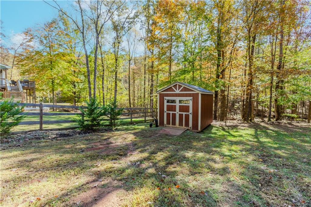 43 Water Lily Way Pendergrass, GA 30567 - Photo 57 of 71 a view of a house with a yard and large trees