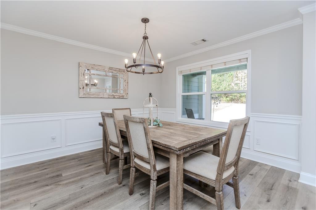 43 Water Lily Way Pendergrass, GA 30567 - Photo 7 of 71 a view of a dining room with furniture window and wooden floor