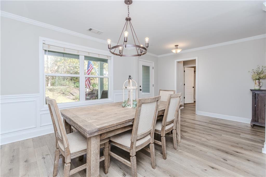 43 Water Lily Way Pendergrass, GA 30567 - Photo 8 of 71 a view of a dining room with furniture window and wooden floor