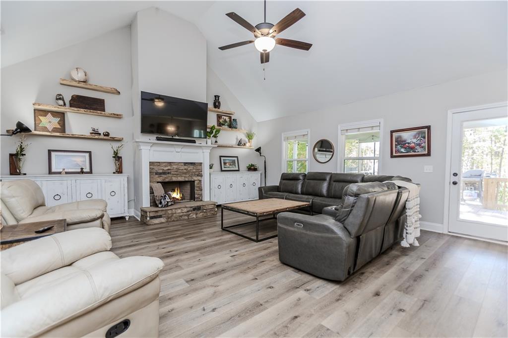 43 Water Lily Way Pendergrass, GA 30567 - Photo 9 of 71 a living room with furniture fireplace and flat screen tv