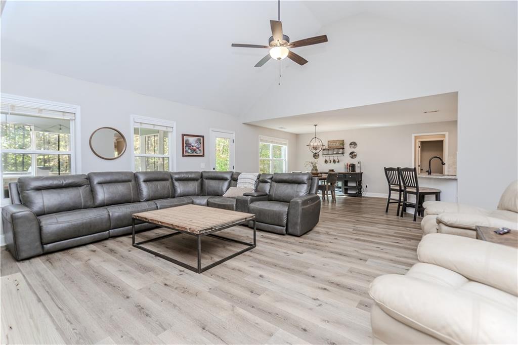 43 Water Lily Way Pendergrass, GA 30567 - Photo 10 of 71 a living room with furniture ceiling fan and a window