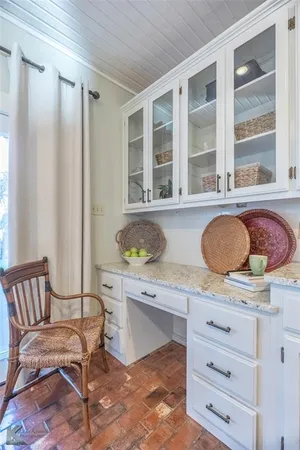 a living room with granite countertop furniture and a window