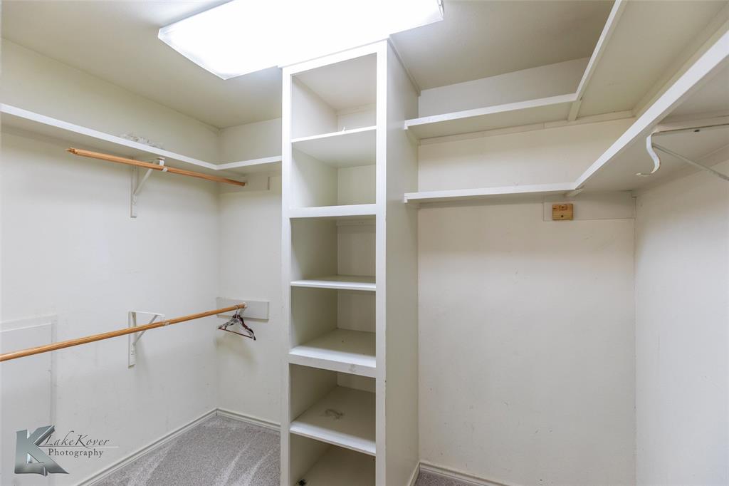 1198 Iberis Road South, Unit B Tuscola, TX 79562 - Photo 32 of 40 a view of walk in closet with empty racks
