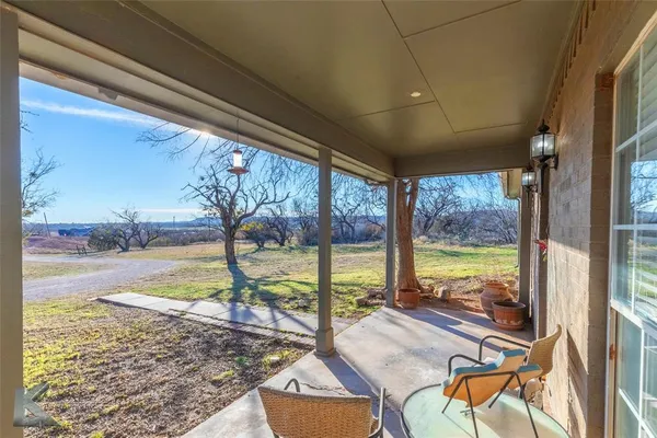 a view of a floor to ceiling window and an outdoor kitchen