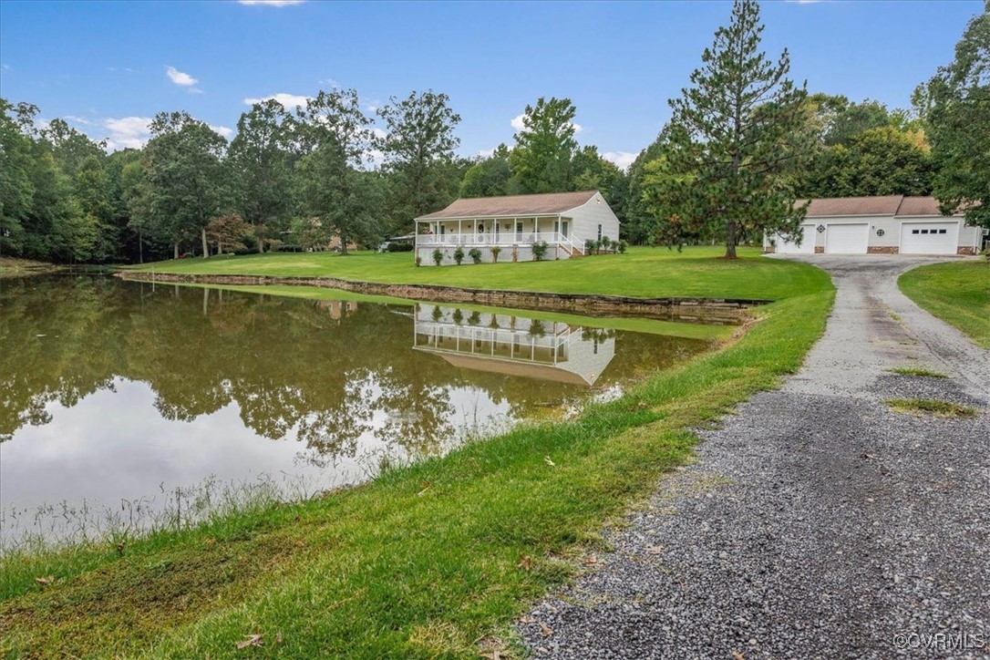3528 Maple Ridge Lane Hopewell, VA 23860 - Photo 1 of 29 a view of a house with a yard and a pond