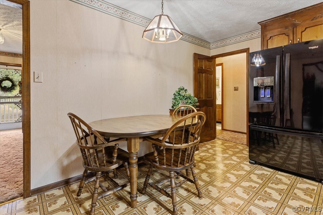 3528 Maple Ridge Lane Hopewell, VA 23860 - Photo 17 of 29 a view of a dining room with furniture and chandelier