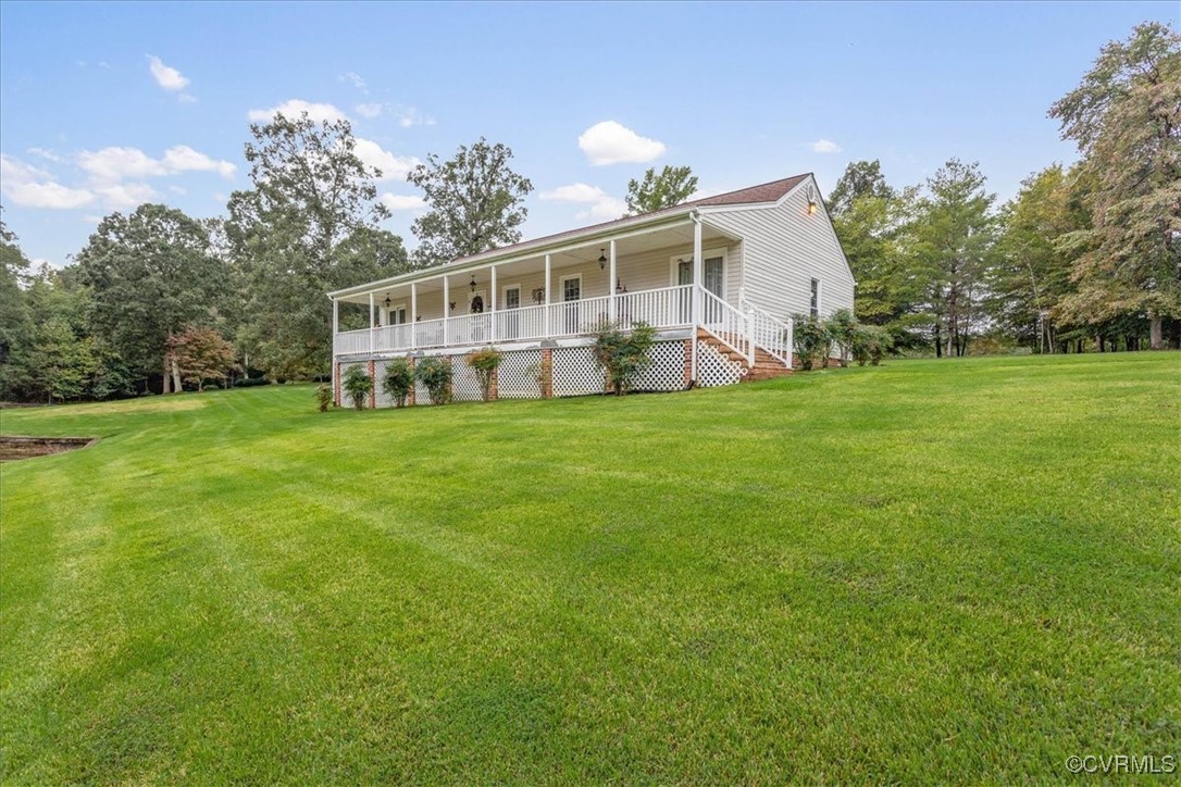 3528 Maple Ridge Lane Hopewell, VA 23860 - Photo 2 of 29 a front view of a house with a garden