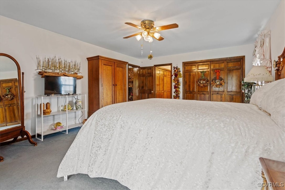 3528 Maple Ridge Lane Hopewell, VA 23860 - Photo 23 of 29 a bed sitting in a bedroom and chandelier