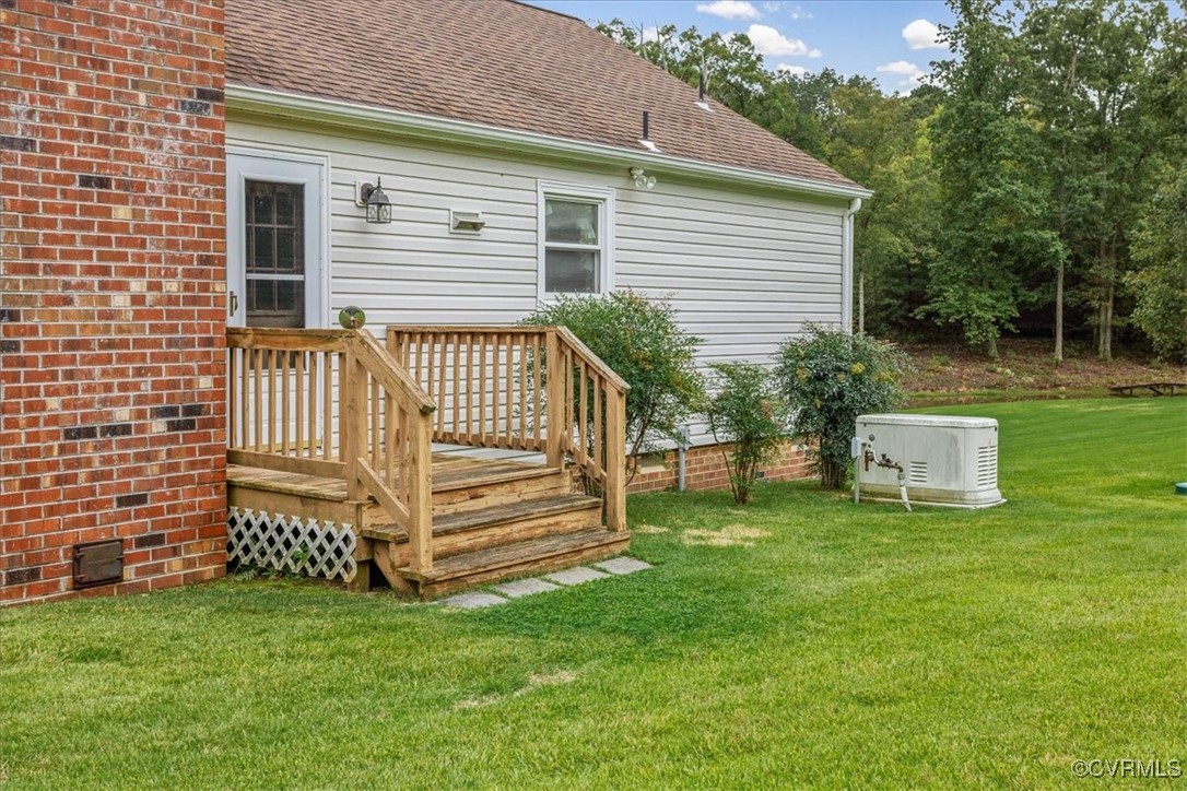 3528 Maple Ridge Lane Hopewell, VA 23860 - Photo 27 of 29 a front view of a house with a garden