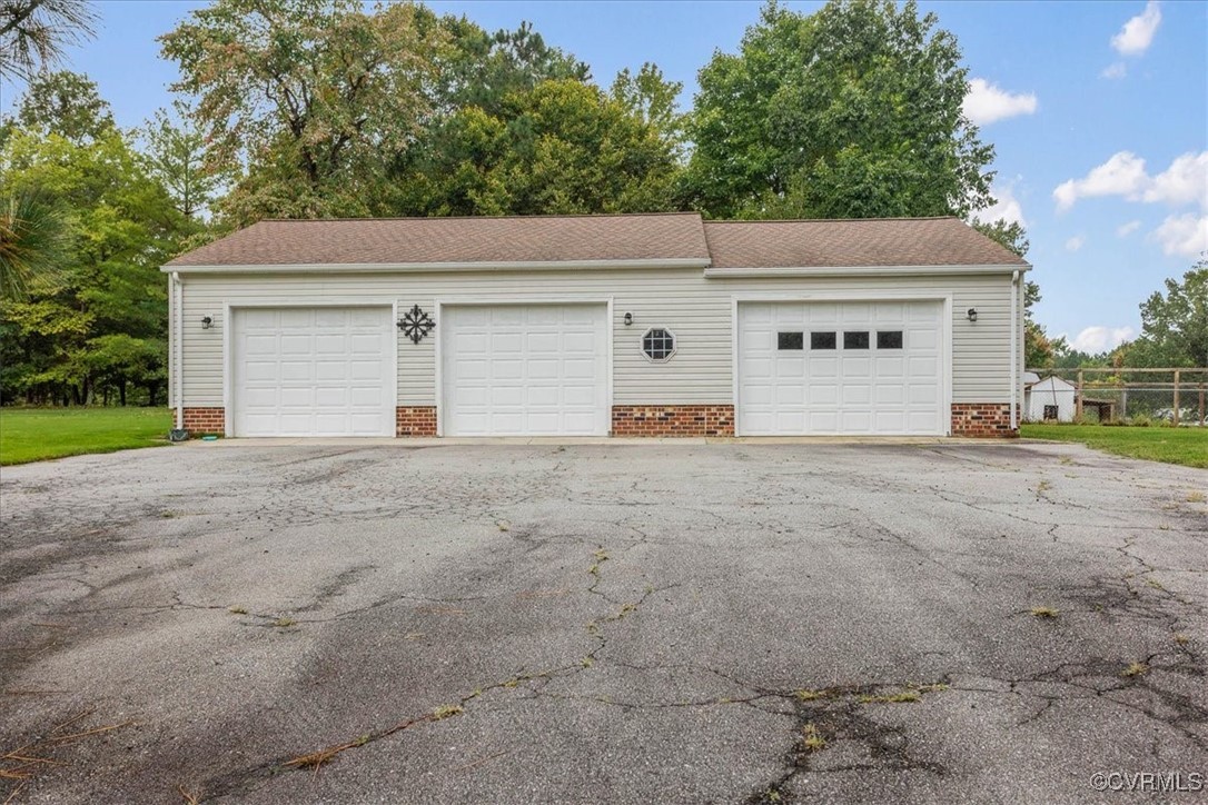 3528 Maple Ridge Lane Hopewell, VA 23860 - Photo 6 of 29 a view of a white house with a outdoor space and yard