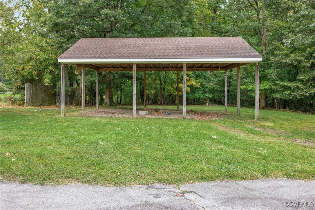 3528 Maple Ridge Lane Hopewell, VA 23860 - Photo 7 of 29 a backyard of a house with lots of green space
