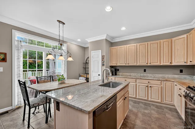 a kitchen with center island table and chairs in it