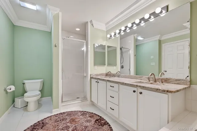 a bathroom with a granite countertop sink a large mirror a bathtub and vanity