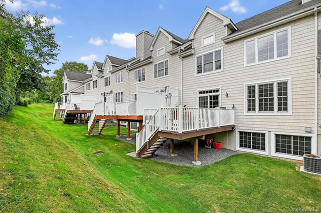 a view of a chairs and table in patio