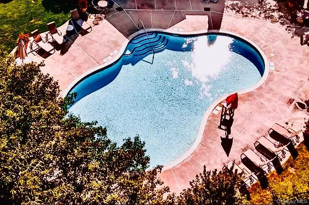 a front view of a house with garden and deck