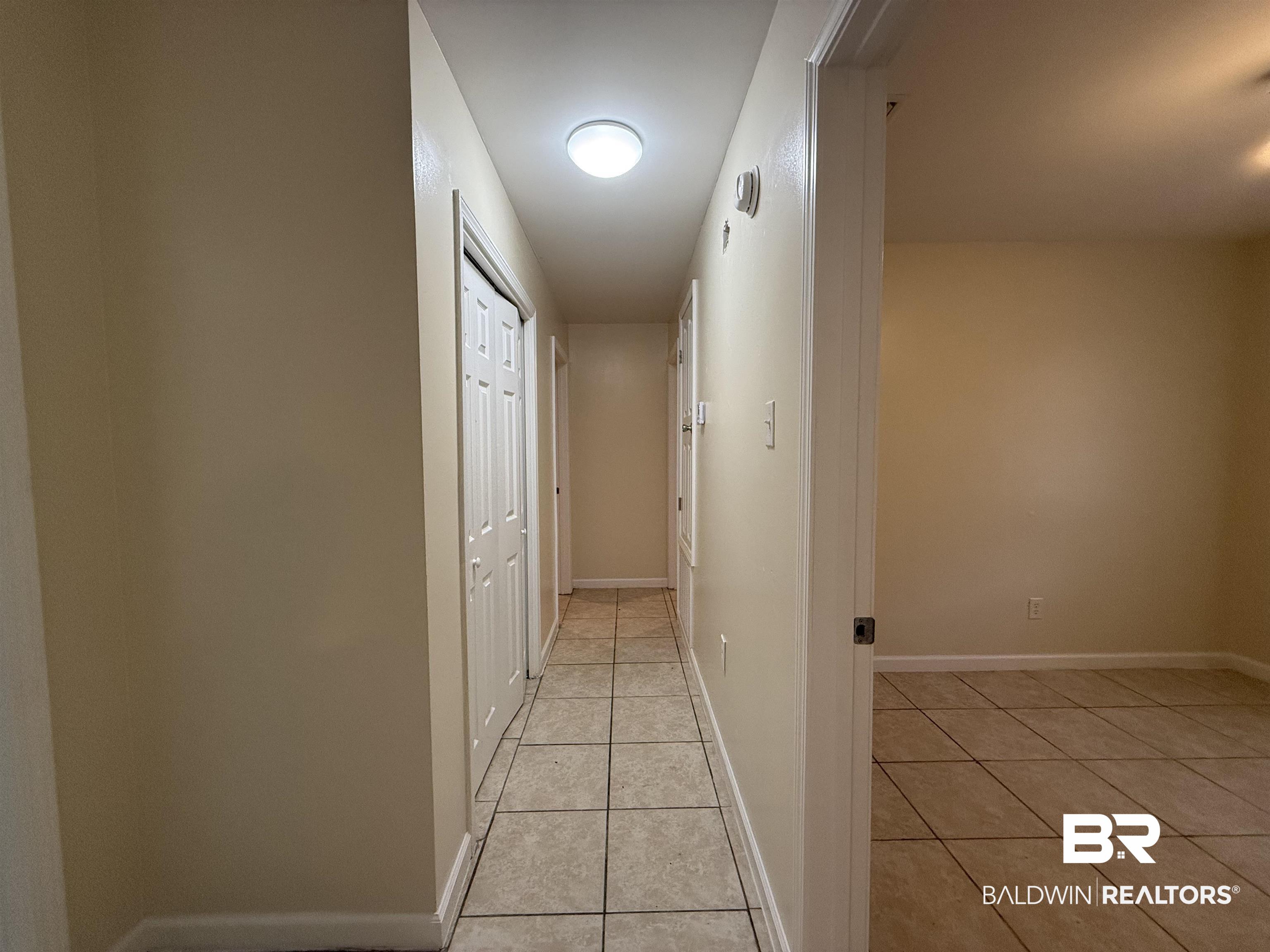 320 E Street Prichard, AL 36610 - Photo 5 of 16 Hallway featuring light tile patterned floors