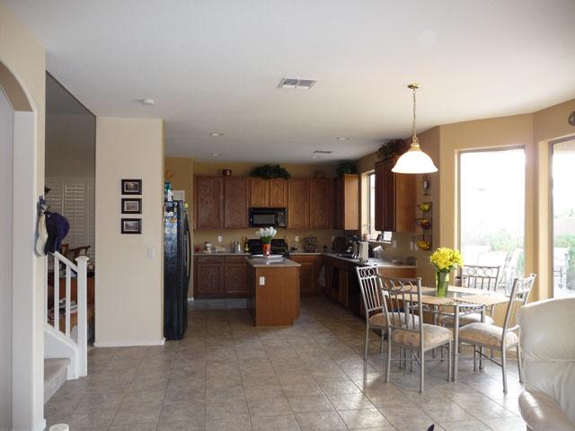 2416 West Carter Road Phoenix, AZ 85041 - Photo 11 of 32 a kitchen with furniture and windows