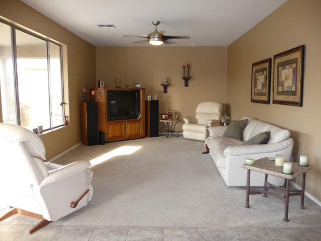 2416 West Carter Road Phoenix, AZ 85041 - Photo 12 of 32 a living room with furniture and a chandelier