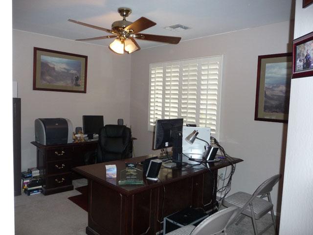 2416 West Carter Road Phoenix, AZ 85041 - Photo 25 of 32 a view of a workspace with furniture and a window
