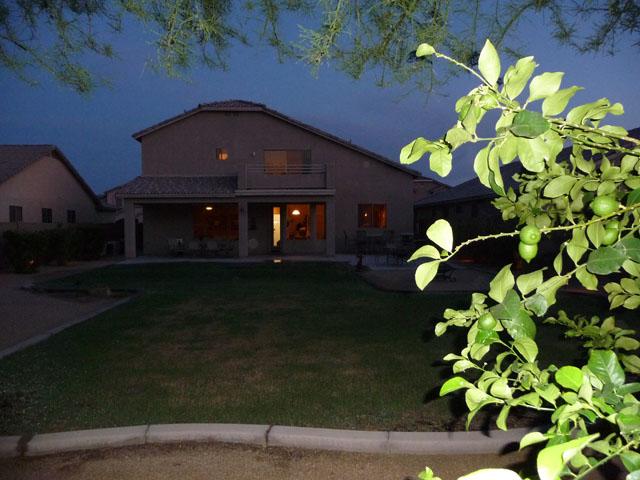 2416 West Carter Road Phoenix, AZ 85041 - Photo 27 of 32 a front view of a house with a garden