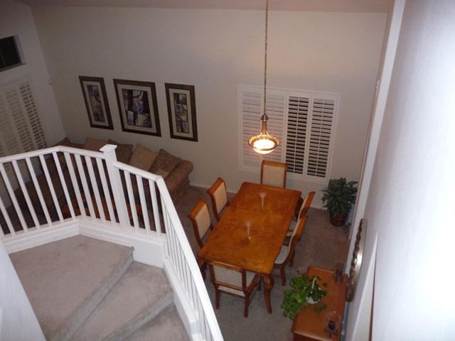 2416 West Carter Road Phoenix, AZ 85041 - Photo 29 of 32 a balcony with table and chairs