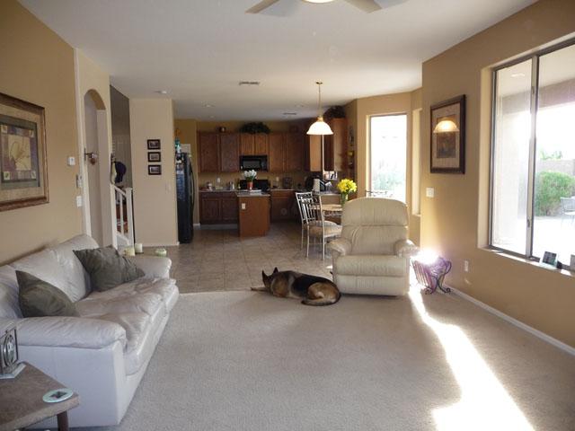 2416 West Carter Road Phoenix, AZ 85041 - Photo 10 of 32 a living room with furniture and a large window