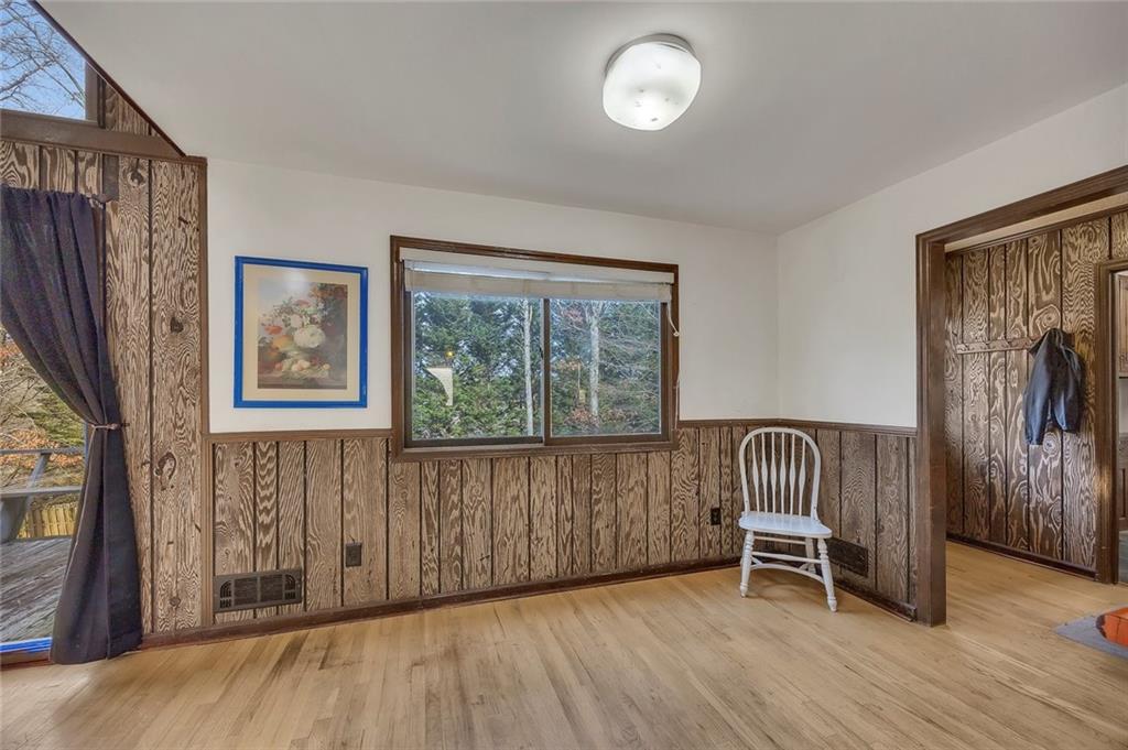 1113 Honeysuckle Drive Canton, GA 30114 - Photo 12 of 57 an empty room with windows and wooden floor