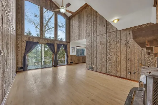 a view of a livingroom with an empty space and a fireplace