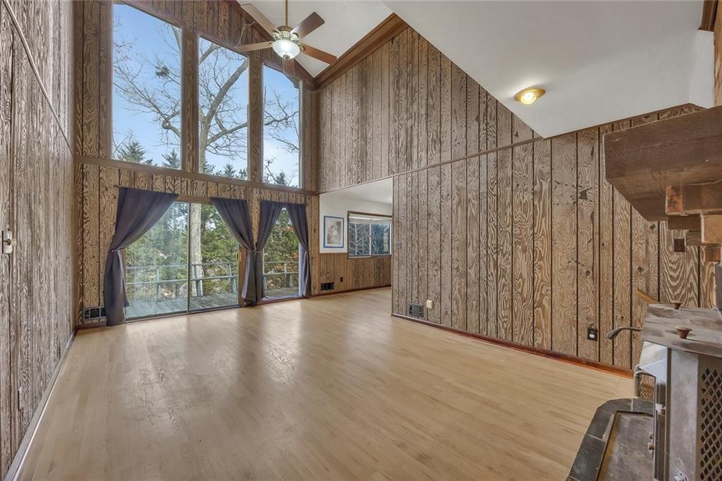 1113 Honeysuckle Drive Canton, GA 30114 - Photo 16 of 57 a view of a porch with wooden floor and windows
