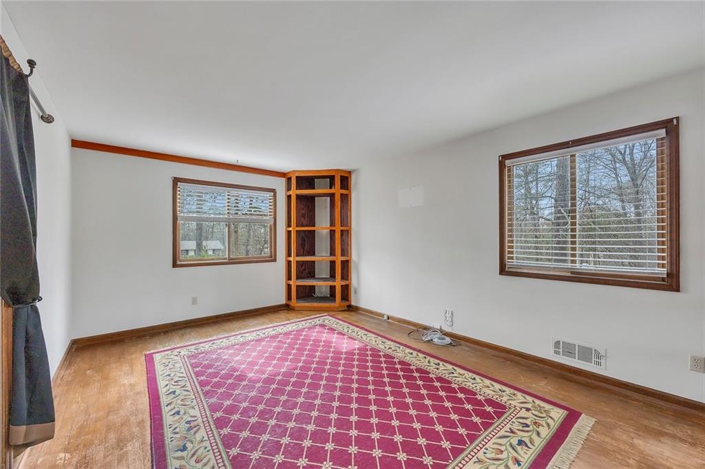 1113 Honeysuckle Drive Canton, GA 30114 - Photo 20 of 57 a view of an empty room with windows
