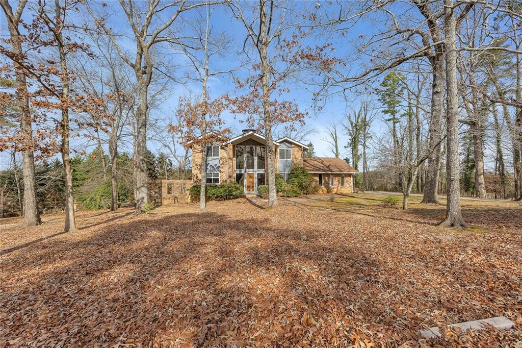 1113 Honeysuckle Drive Canton, GA 30114 - Photo 2 of 57 a front view of a house with a yard