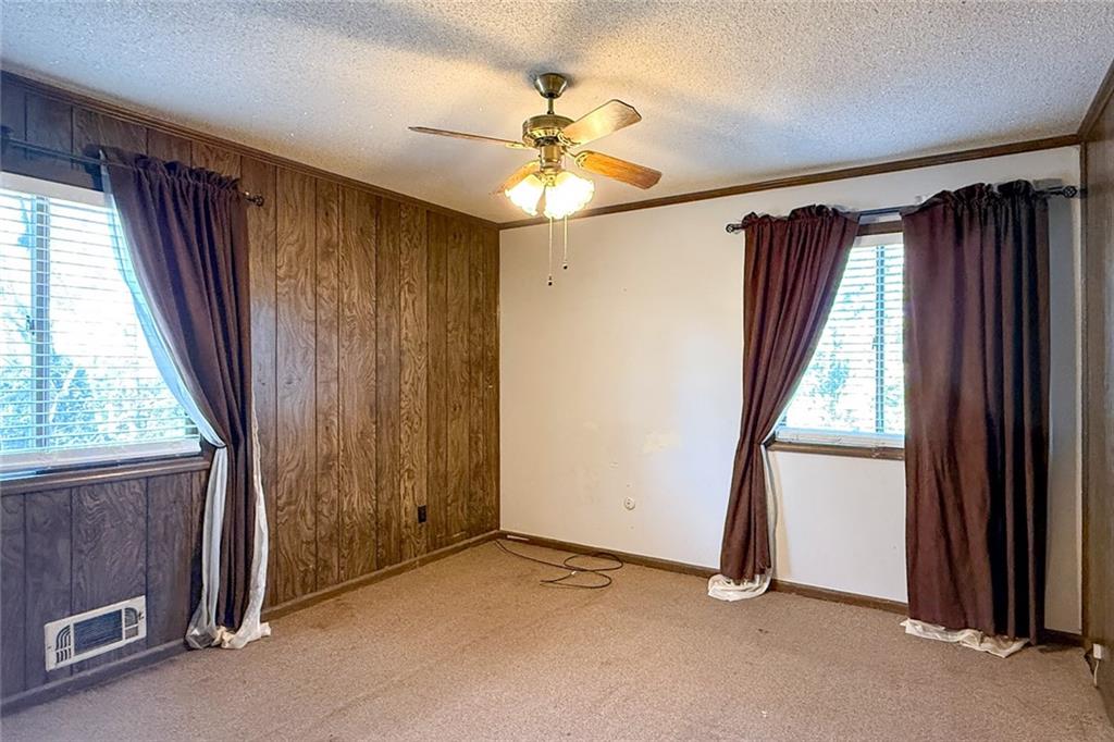 1113 Honeysuckle Drive Canton, GA 30114 - Photo 23 of 57 an empty room with windows and closet
