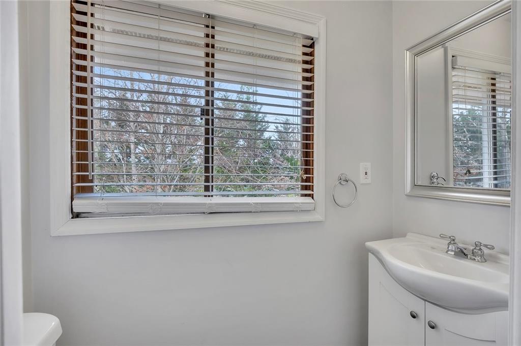 1113 Honeysuckle Drive Canton, GA 30114 - Photo 27 of 57 a bathroom with a sink toilet and tub