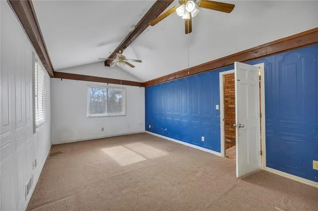 a bathroom with a granite countertop toilet sink and shower