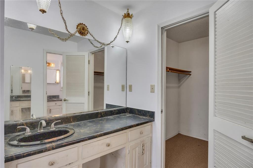 1113 Honeysuckle Drive Canton, GA 30114 - Photo 30 of 57 a bathroom with a granite countertop sink and a mirror