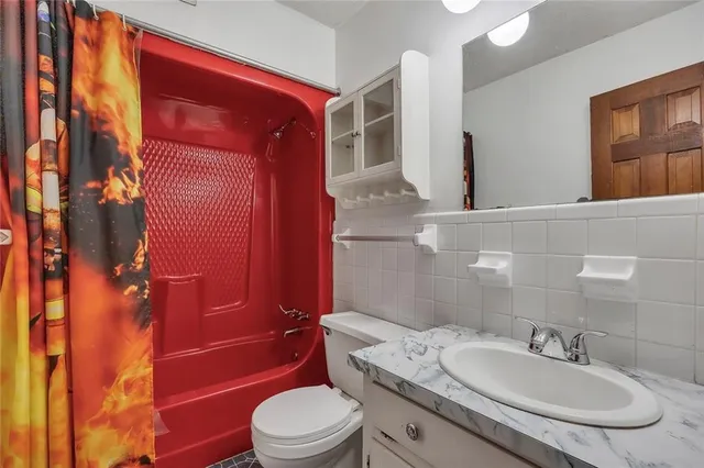 a kitchen with a stove and cabinets
