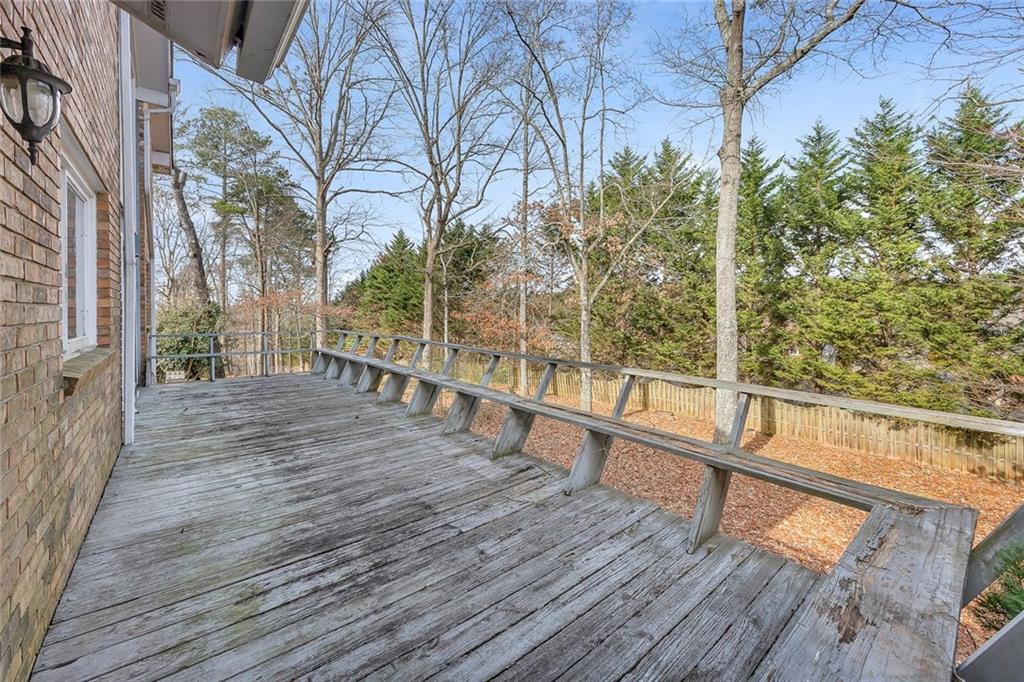 1113 Honeysuckle Drive Canton, GA 30114 - Photo 47 of 57 a view of balcony with wooden floor and fence